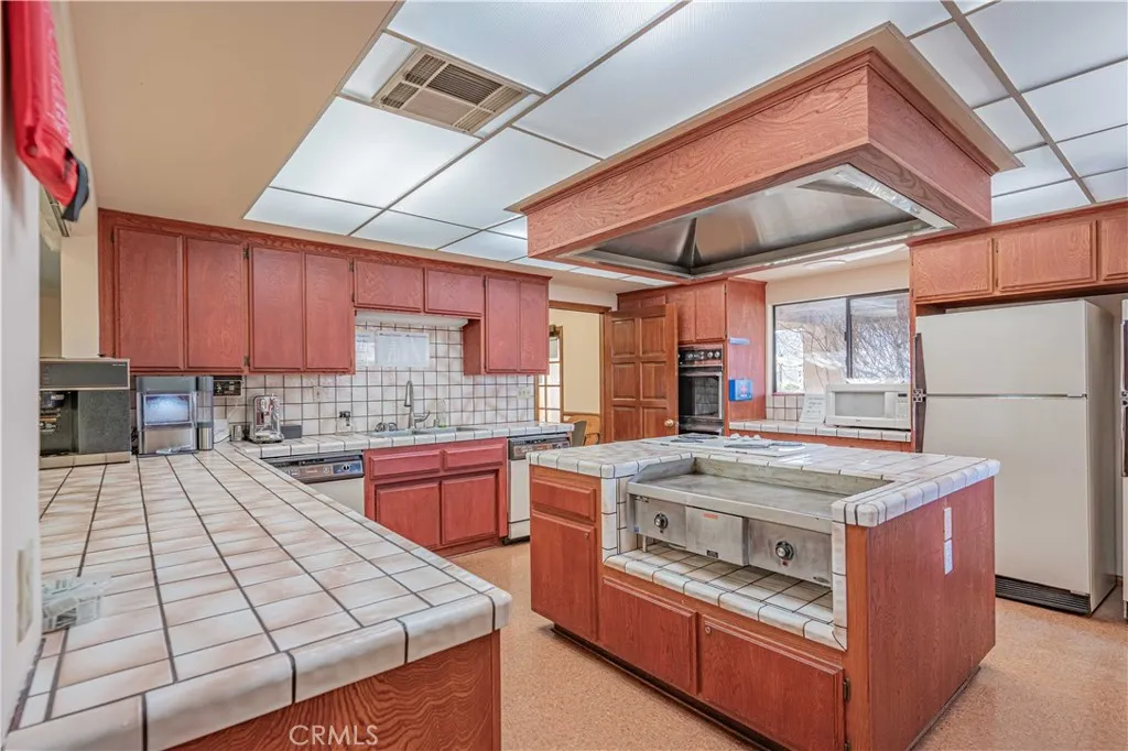 27250 Murrieta Road, Unit 216 Menifee, CA 92586 - Photo 48 of 58 a kitchen with a stove and a sink