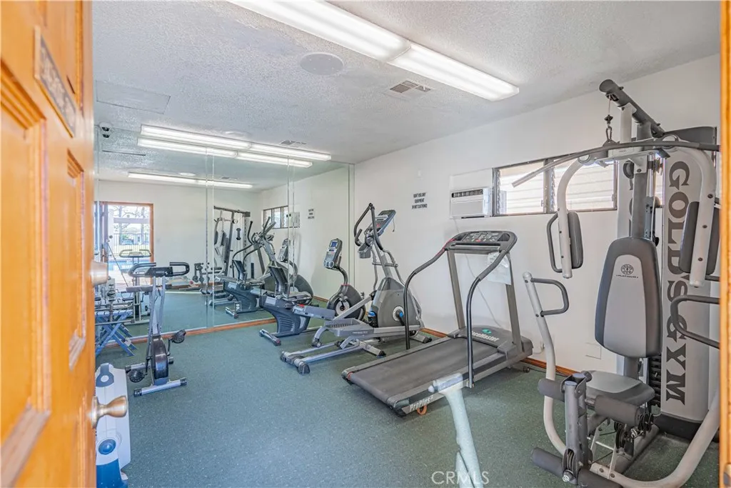 27250 Murrieta Road, Unit 216 Menifee, CA 92586 - Photo 55 of 58 a view of a room with gym equipment
