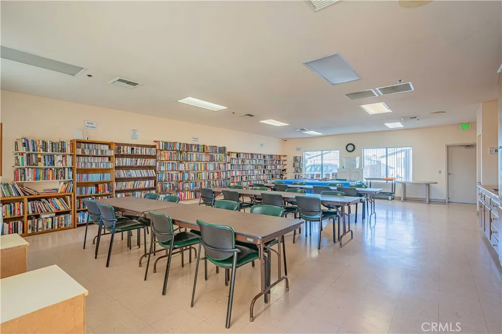 27250 Murrieta Road, Unit 216 Menifee, CA 92586 - Photo 56 of 58 a view of a dining room with furniture and wooden floor