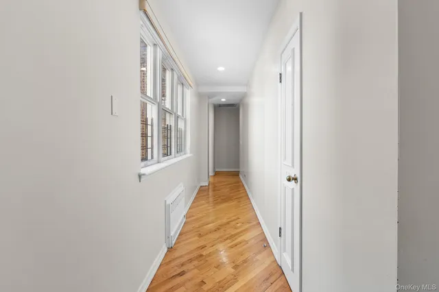 a view of a hallway with a white door