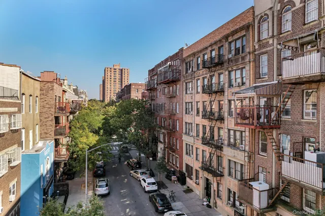 a city street lined with tall buildings