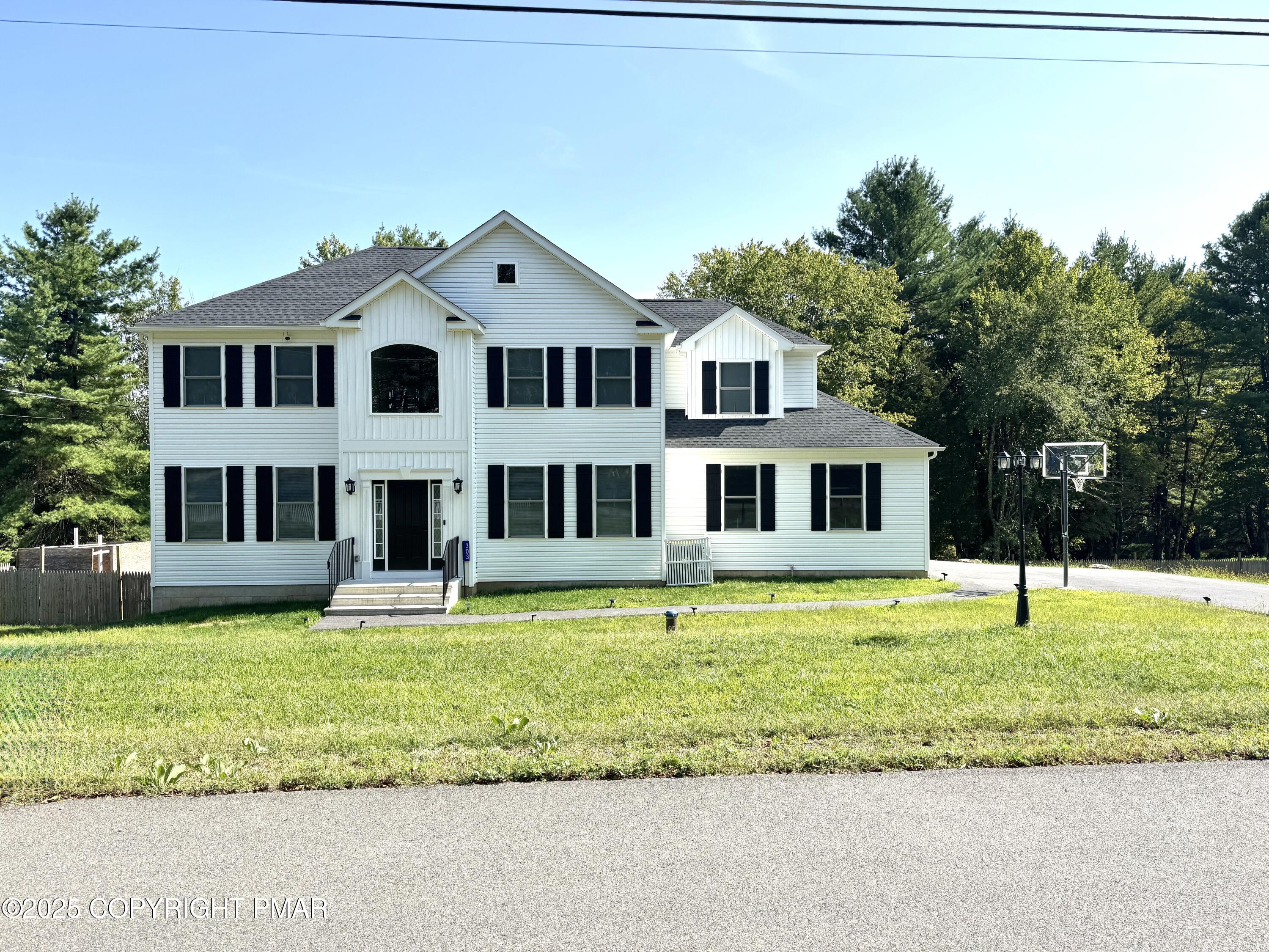 a view of a house with a yard porch and sitting area
