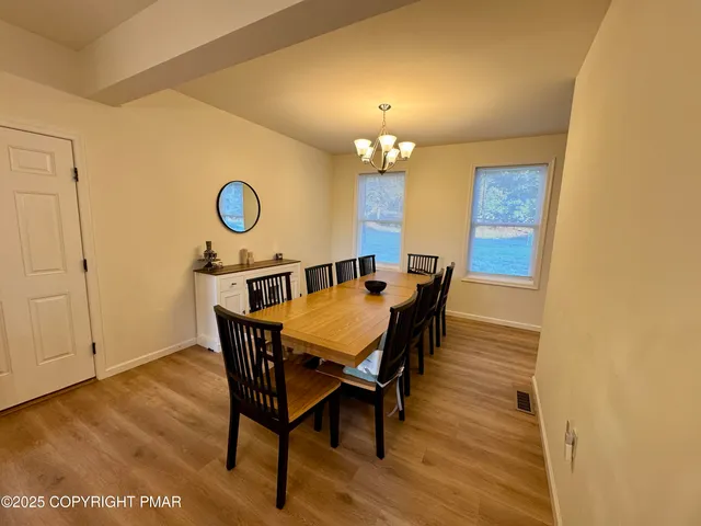 a very nice looking dining room with a table and chairs