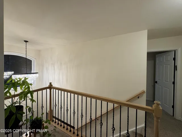 a kitchen with white cabinets and appliances