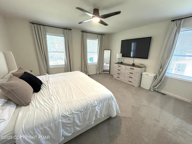 a living room with a flat screen tv