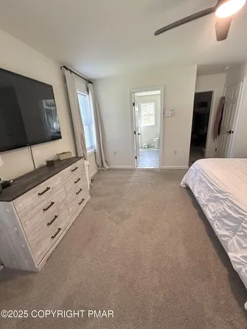 a bathroom with a double vanity sink and mirror with bathtub