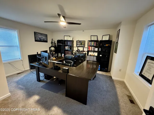 a view of a livingroom with a workspace
