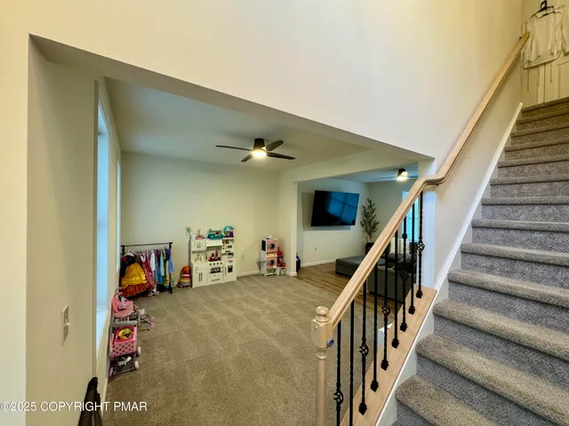 a view of a livingroom with stairs stairs