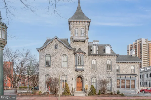 a view of a big house with many windows