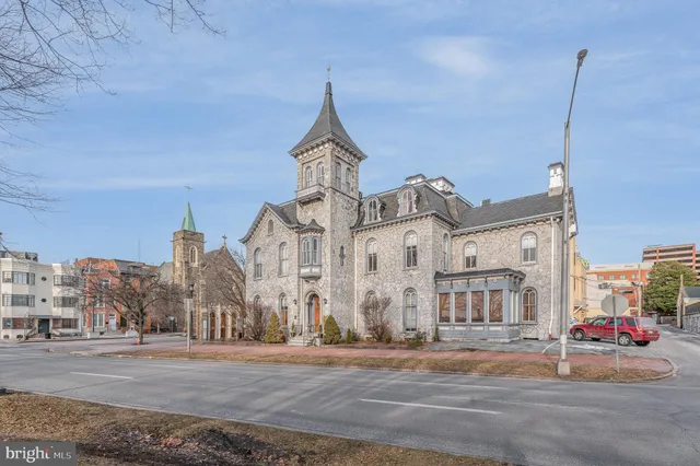 a view of a street with a building in the background