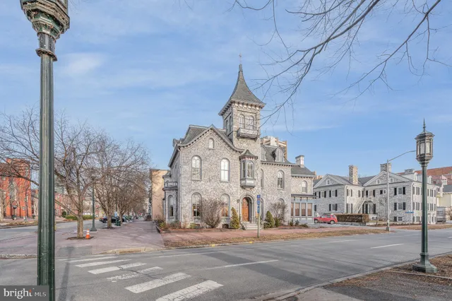 a view of a street with a building in the background
