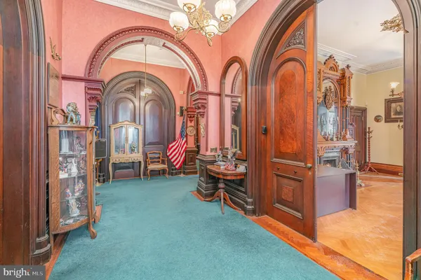 a view of hall way with furniture