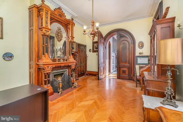 a living room with fireplace furniture and decor