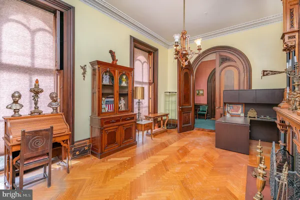 a living room filled with furniture and a window