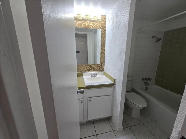 an empty room with wooden floor