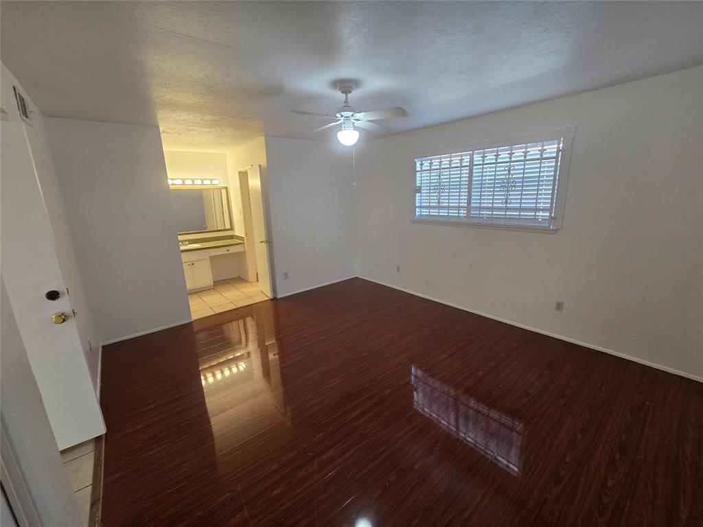 8071 Meadow Road, Unit 218 Dallas, TX 75231 - Photo 10 of 24 a view of livingroom and hardwood