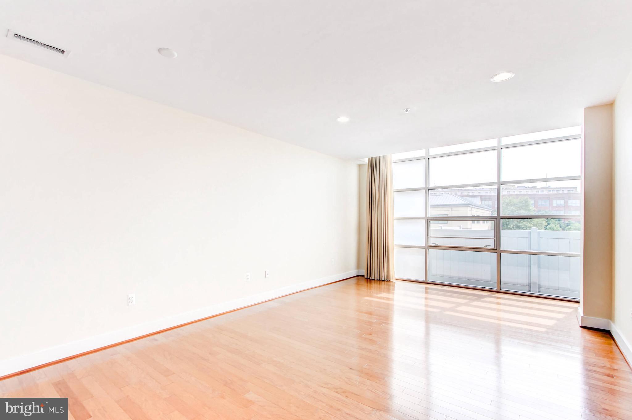 2772 Lighthouse Point East, Unit 202 Baltimore, MD 21224 - Photo 6 of 35 Ceiling to Floor Windows