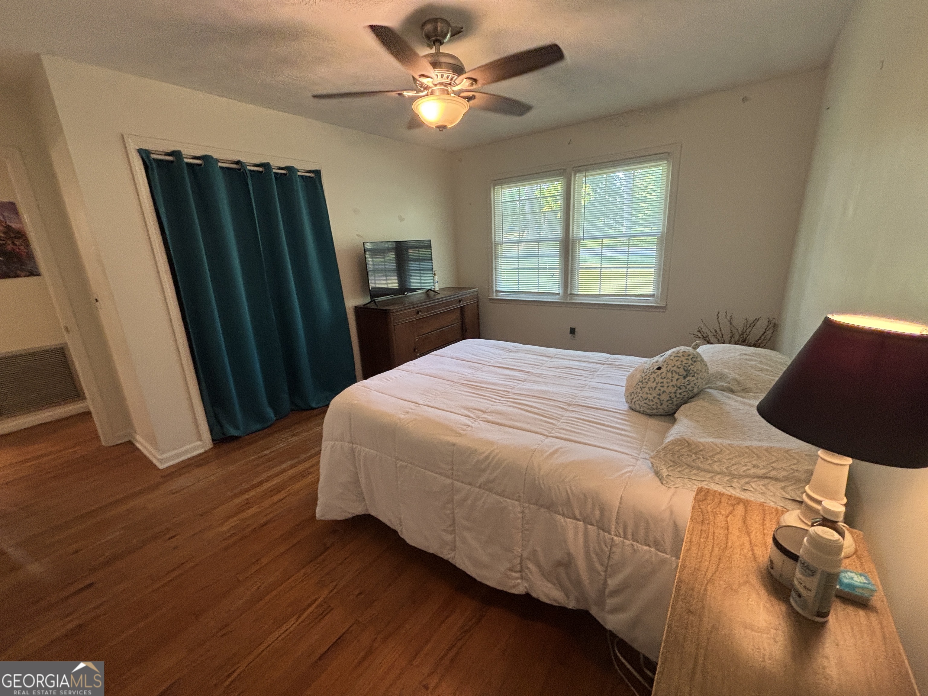 152 Crest Drive Cochran, GA 31014 - Photo 27 of 54 a bedroom with a bed and a window