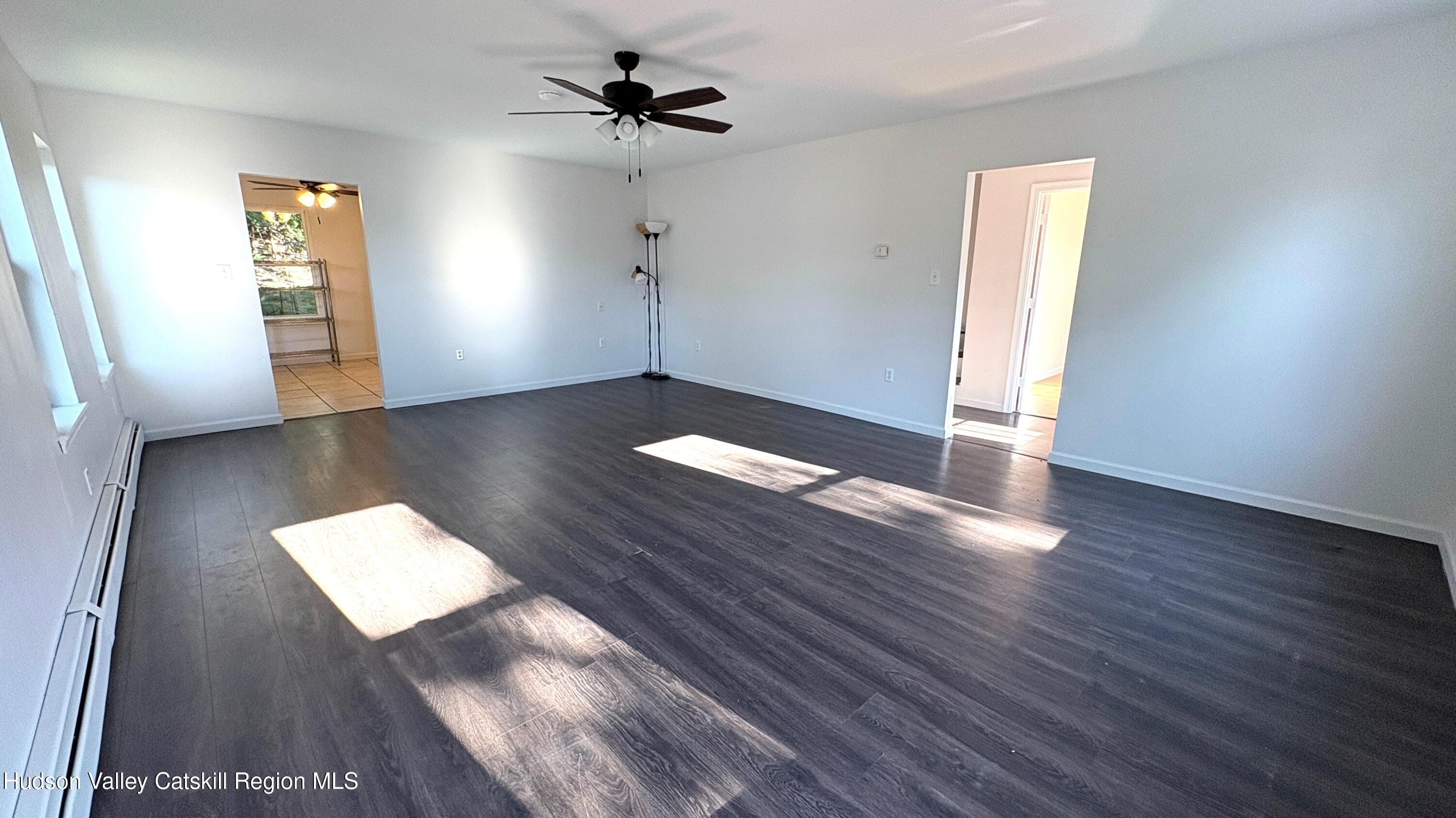 34 North Street, Unit 2 Catskill, NY 12414 - Photo 2 of 19 a view of empty room with wooden floor and fan