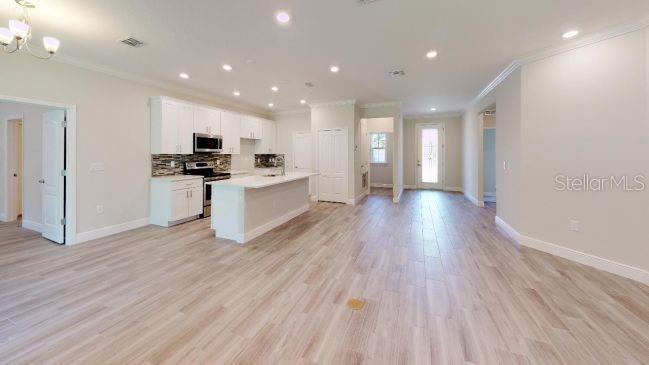 Tbd Mohawk Road Venice, FL 34293 - Photo 6 of 16 a kitchen with stainless steel appliances a refrigerator sink and wooden floor