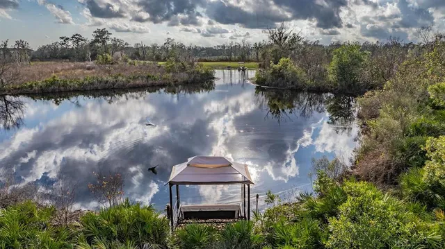 a view of a lake with sitting area