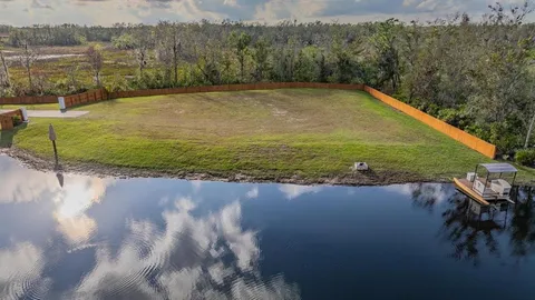 a view of a swimming pool with a yard