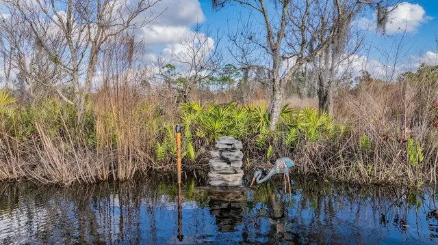 a balcony with table and chairs