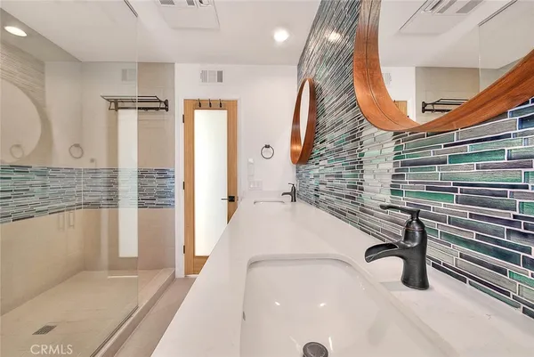 a view of a hallway with washer and dryer