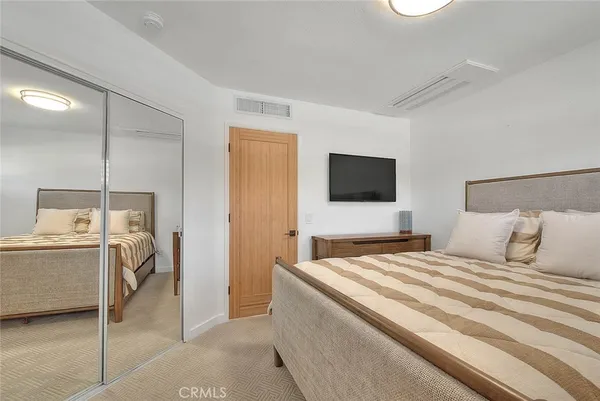 a bathroom with a tub shower sink and mirror