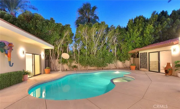 a view of a swimming pool with an outdoor space