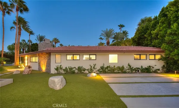 front view of a house with a swimming pool
