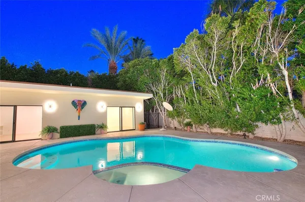 a view of a swimming pool with a patio