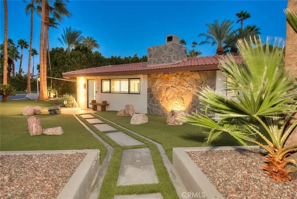 a view of a house with swimming pool