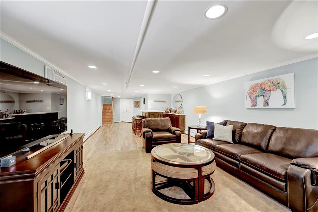 7607 Colonial Road Brooklyn, NY 11209 - Photo 24 of 35 a living room with furniture and a flat screen tv