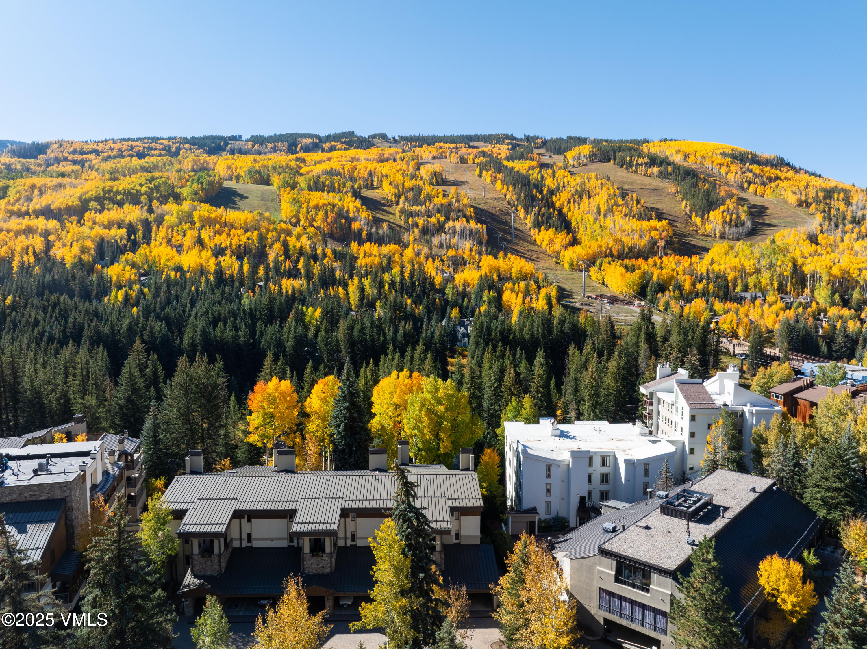 390 East Lionshead Circle, Unit 103 Vail, CO 81657 - Photo 17 of 22 an aerial view of multiple house with a yard