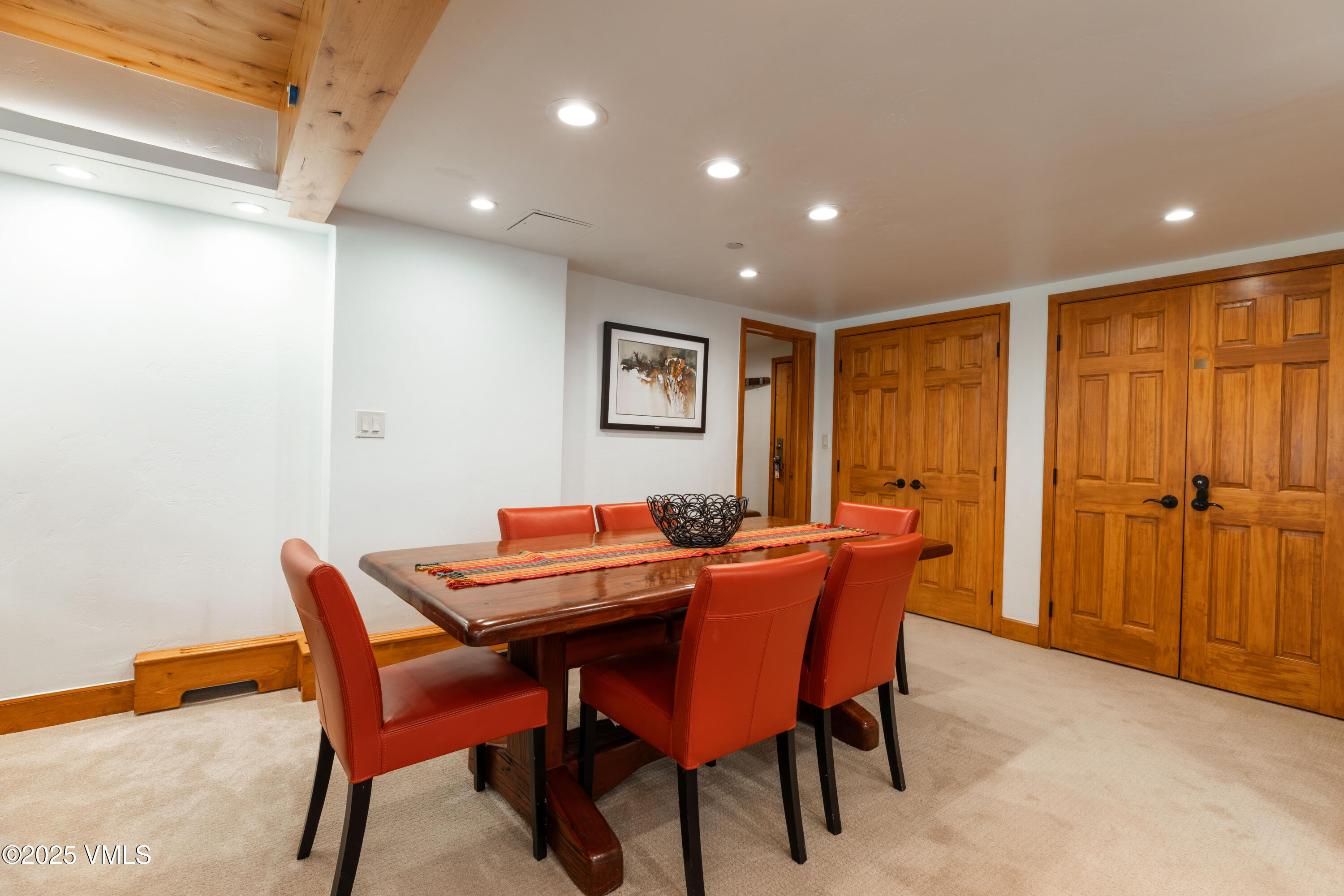 390 East Lionshead Circle, Unit 103 Vail, CO 81657 - Photo 4 of 22 a dining room with furniture and window