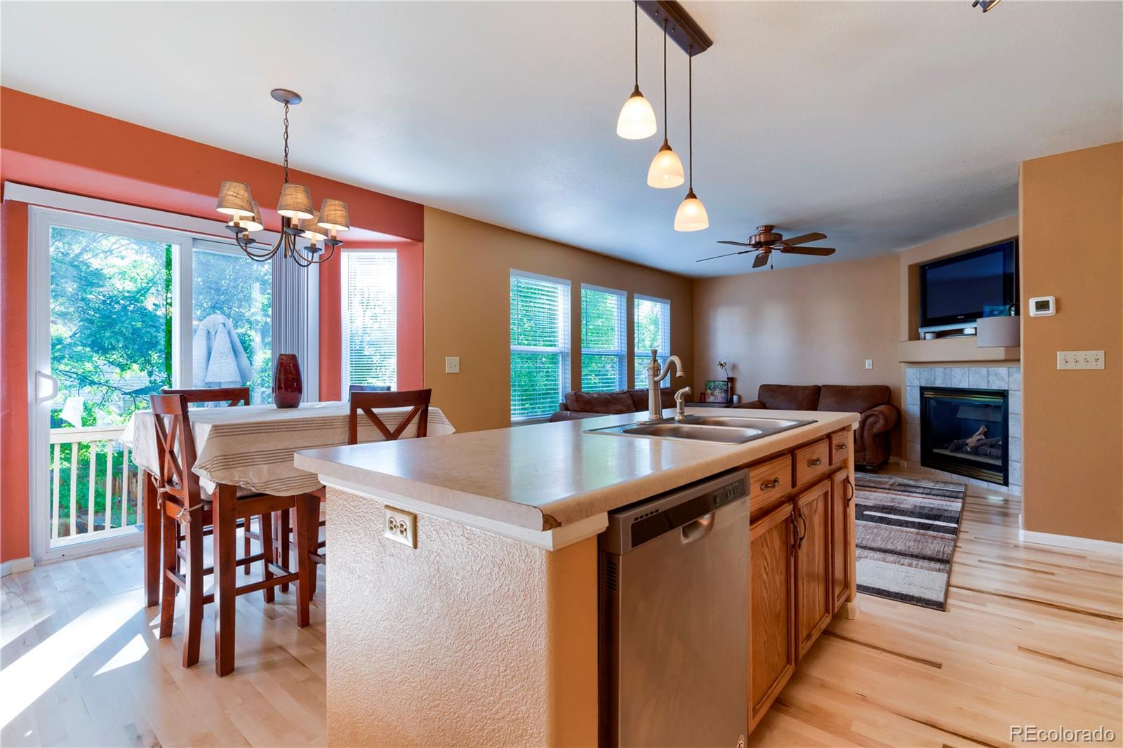 1290 Trail Ridge Road Longmont, CO 80504 - Photo 11 of 38 a kitchen with stainless steel appliances granite countertop a sink a stove and a refrigerator