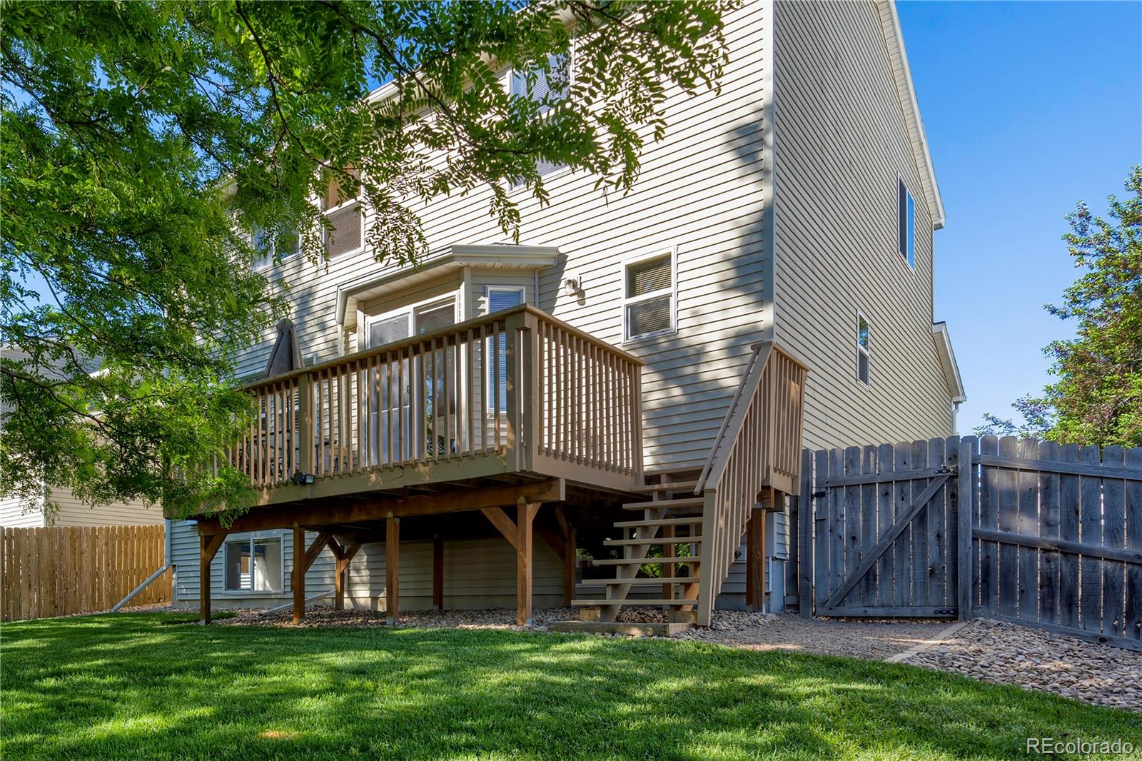 1290 Trail Ridge Road Longmont, CO 80504 - Photo 37 of 38 a view of a house with a yard balcony and furniture