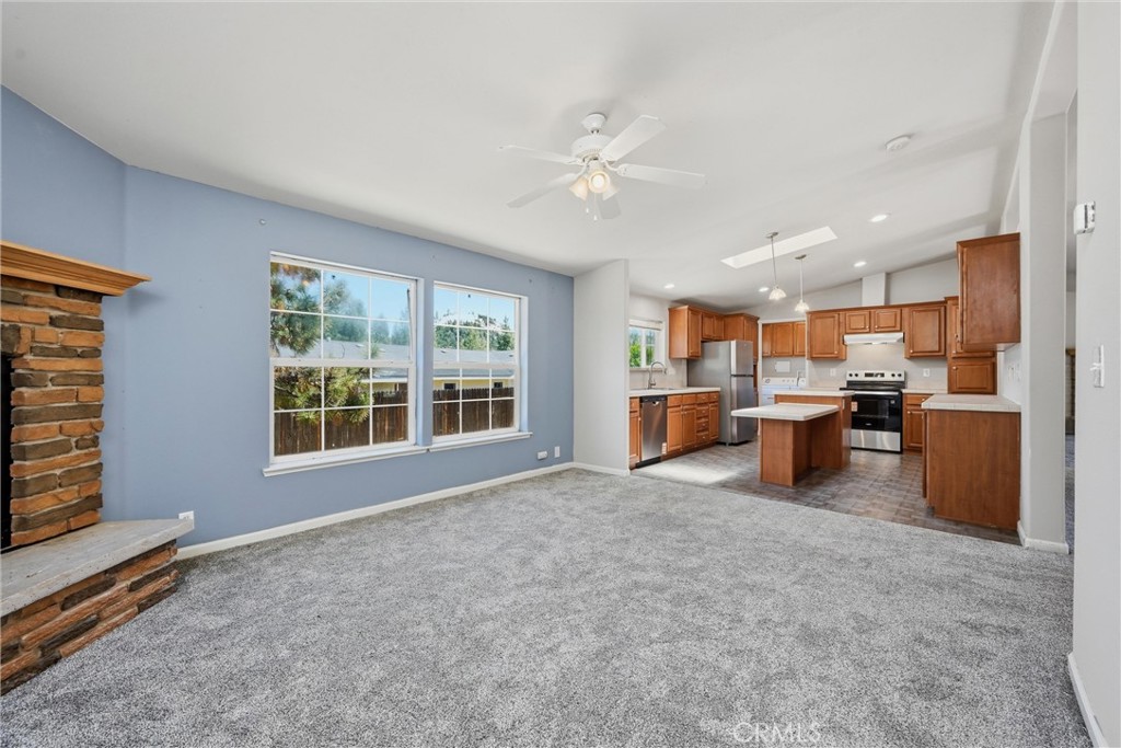 2860 Spring Valley Road Clearlake Oaks, CA 95423 - Photo 11 of 38 a living room with furniture and a kitchen