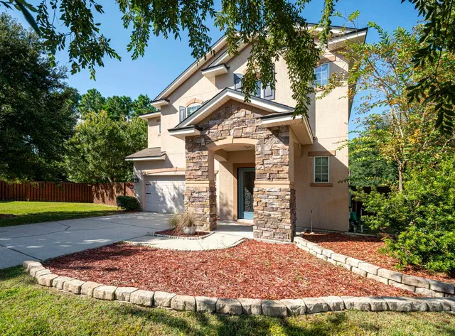 a view of a house with basketball court
