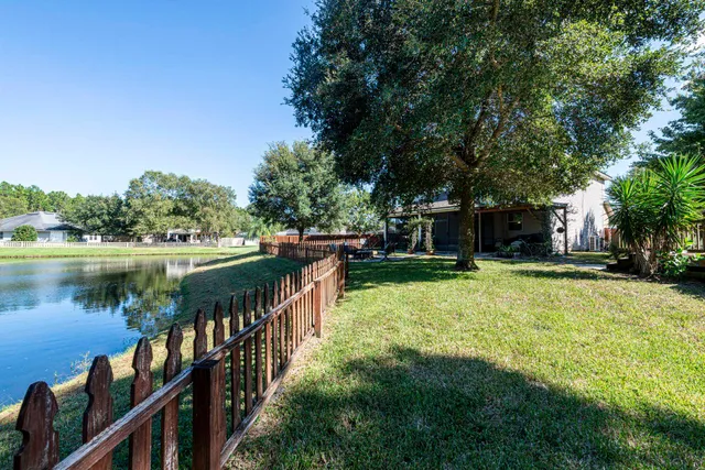 a view of a backyard with a small cabin