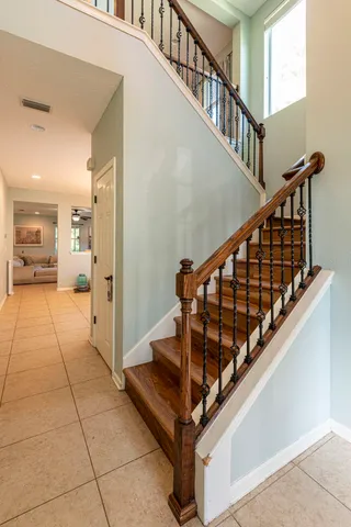 a view of entryway and hall with wooden floor