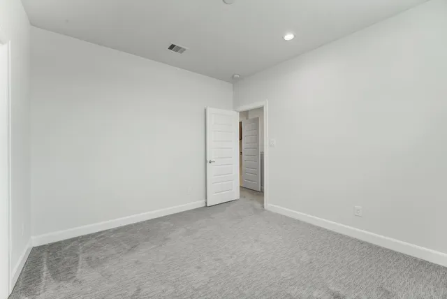 a bathroom with a granite countertop sink a toilet and a bathtub