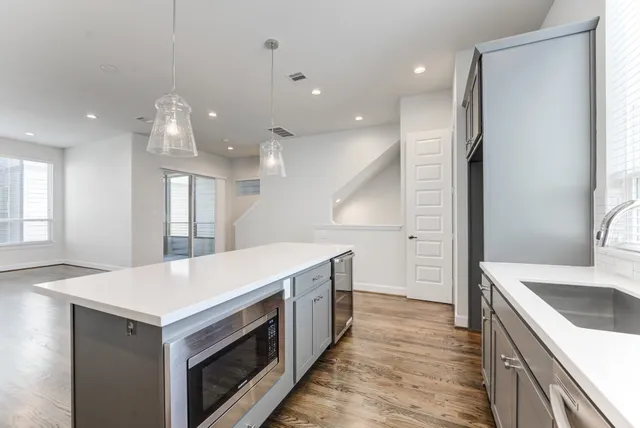 a kitchen with a stove and a sink