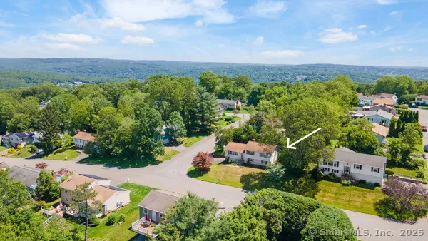 an aerial view of a house with a garden