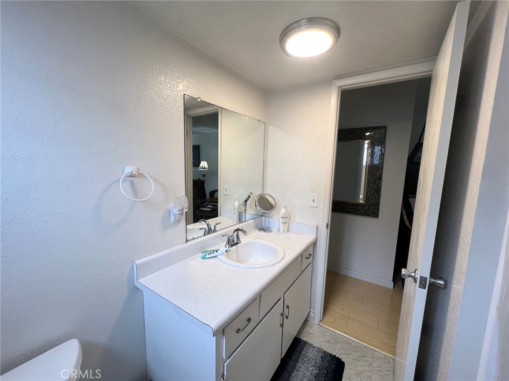 375 Surf Street Morro Bay, CA 93442 - Photo 18 of 25 a bathroom with a sink a mirror and vanity