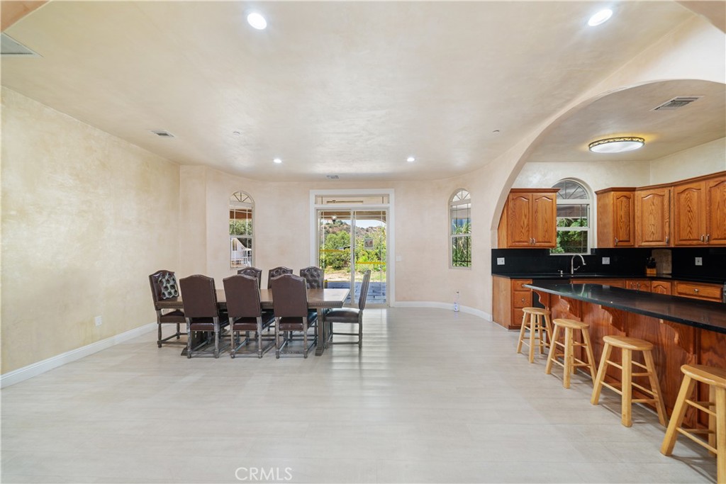 12605 Kagel Canyon Road Sylmar, CA 91342 - Photo 12 of 61 a large kitchen with lots of counter space and chairs