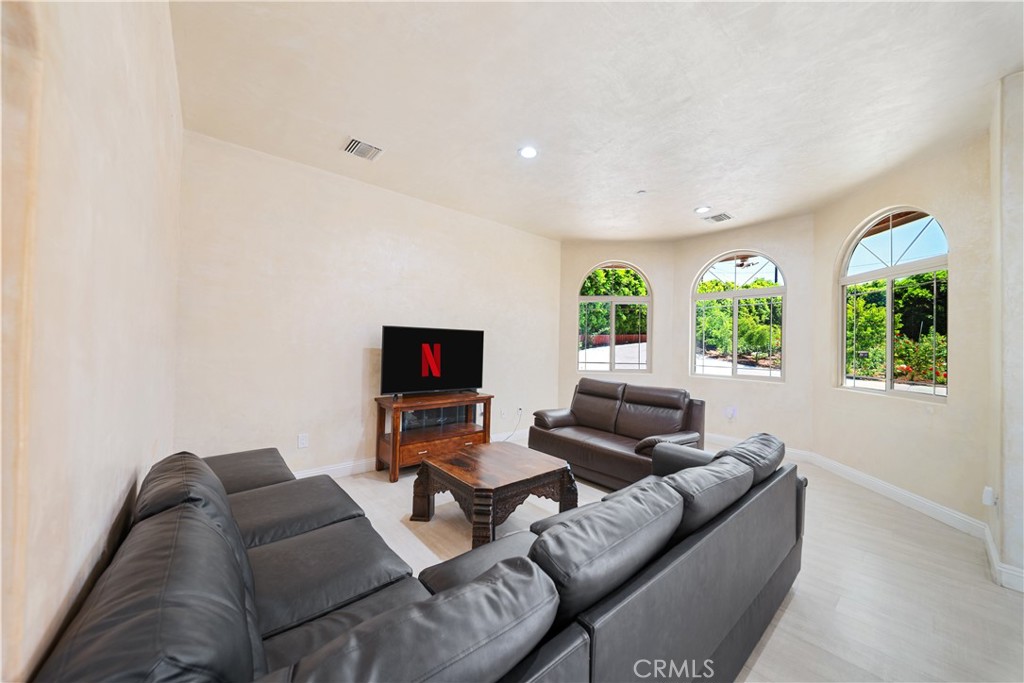 12605 Kagel Canyon Road Sylmar, CA 91342 - Photo 14 of 61 a living room with furniture and a flat screen tv