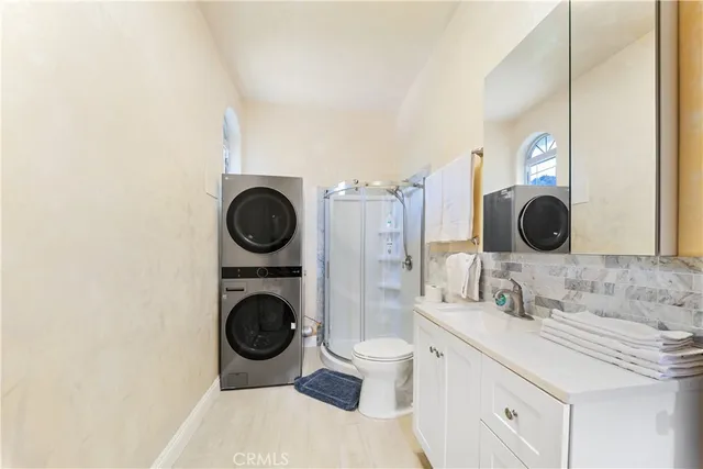 a bedroom with a bed and a lounge chair