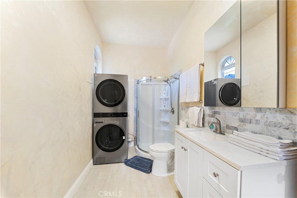 12605 Kagel Canyon Road Sylmar, CA 91342 - Photo 19 of 61 a bathroom with a granite countertop a sink and a mirror